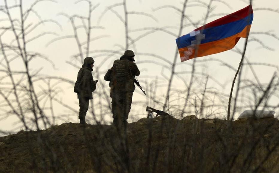 Armenian soldiers guard the outskirts of the village of Khramort.