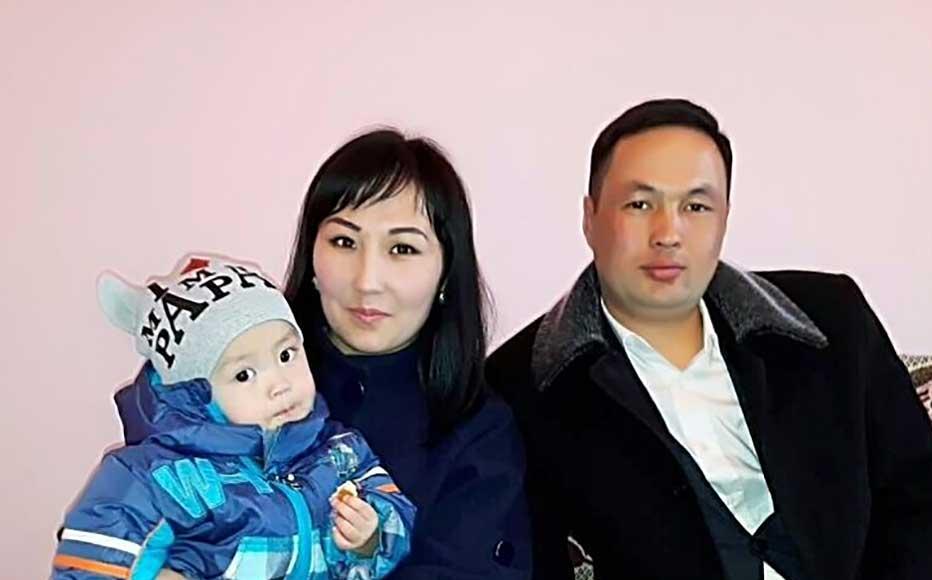 Nazik Akparova, the youngest deputy of the village council of Saruu in the Issyk Kul region of Kyrgyzstan with her son and husband.