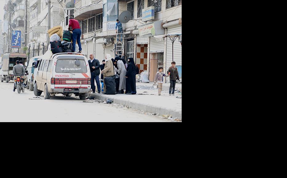 A displaced family from Aleppo’s al-Fardous neighbourhood. (Photo: Hussam Kuwaifatiyeh)