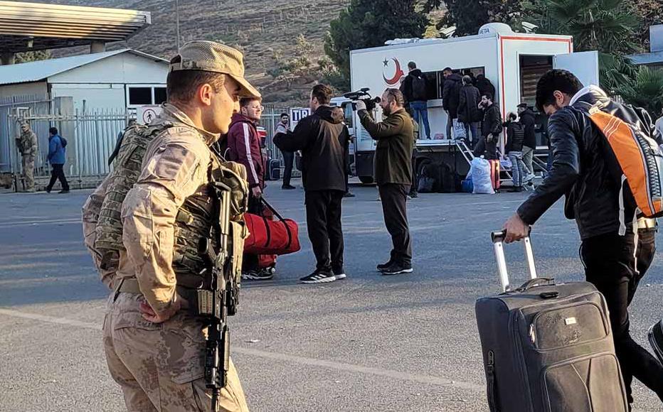Syrian refugees at the Cilvegözü border crossing in Turkey, waiting to return to Syria.