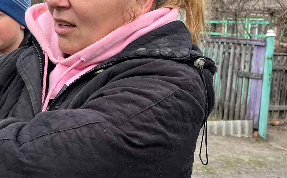 Ruslana Morina (centre), a primary school teacher, stands with fellow locals.