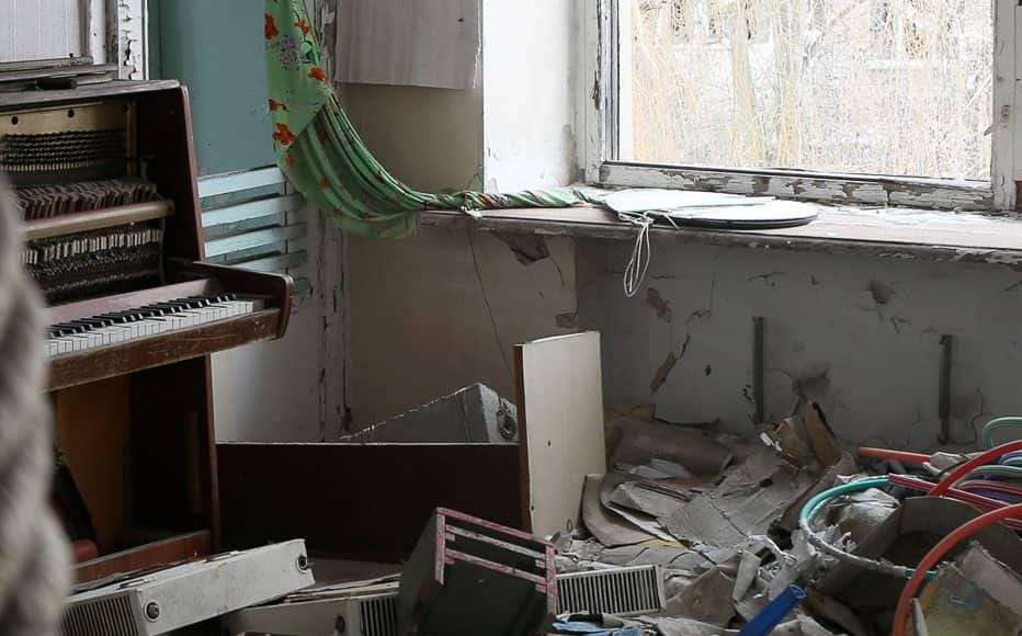 A piano and the remains of belongings in an abandoned kindergarten in Pisky. The village lies a handful of kilometres from the airport of Donetsk. At the height of the fighting for the control of the airport, the village was a key crossing point for the Ukrainian army. The airport fell to the control of the Russian-backed militias in January 2015. (January 25, 2022) A piano and the remains of belongings in an abandoned kindergarten in Pisky. The village lies a handful of kilometres from the airport of Donetsk. At the height of the fighting for the control of the airport, the village was a key crossing point for the Ukrainian army. The airport fell to the control of the Russian-backed militias in January 2015. (January 25, 2022)