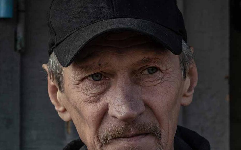 Viktor Sytnykin in the yard of his house. He is clinging on to the hope that the body of his 90-year-old mother Natalia will be identified. "I don't believe [the Russians] will be punished, but I want my mother to have at least a grave," the former forest ranger said.