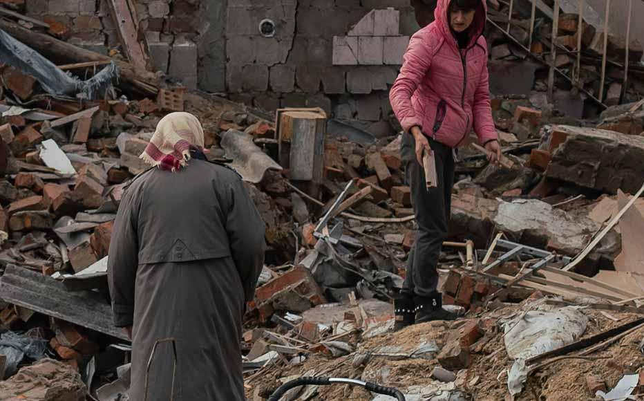 Local residents take all available wood from a destroyed school to use as firewood. There is no heating in the town, and electricity is limited to the bare minimum.