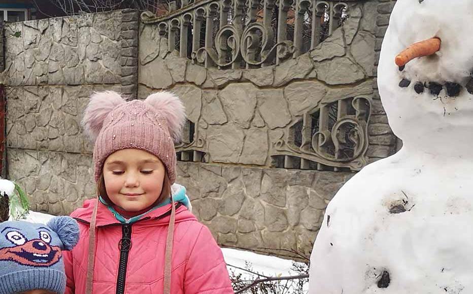 As Ukraine braces for its toughest winter yet, bundled up children walk in a village about 20km from the Russian border. It was occupied by the Russians for six months and liberated during Ukraine's counteroffensive in the east.