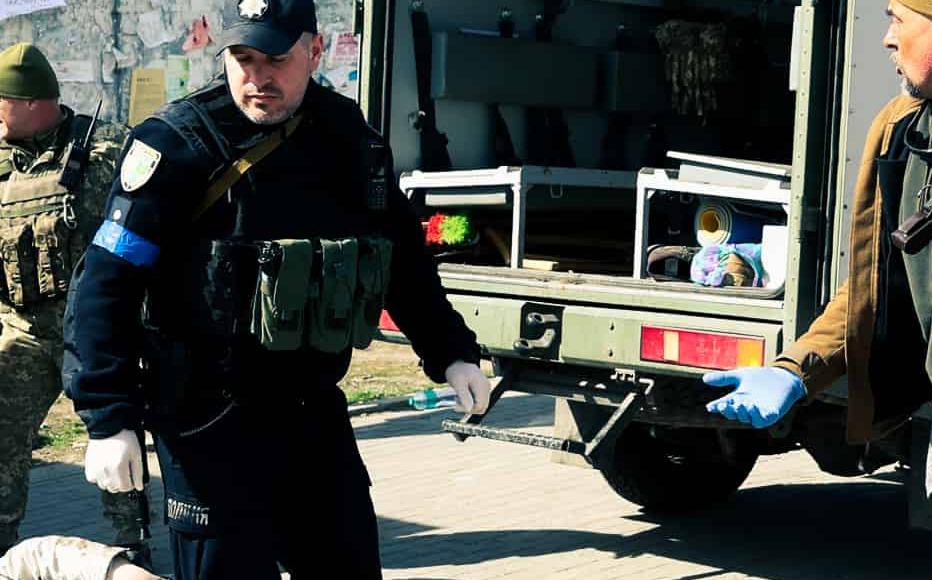 A military medic and police officers try to help people after a rocket attack on the railway station in Kramatorsk, a city with a pre-war population of 157,000, north of Donetsk, eastern Ukraine.