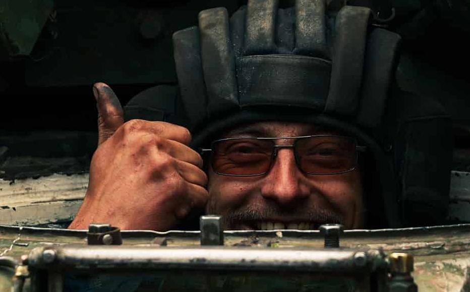 A Ukrainian tanker surfaces from the military vehicle after a successful battle south of Kharkiv region. A Ukrainian tanker surfaces from the military vehicle after a successful battle south of Kharkiv region.