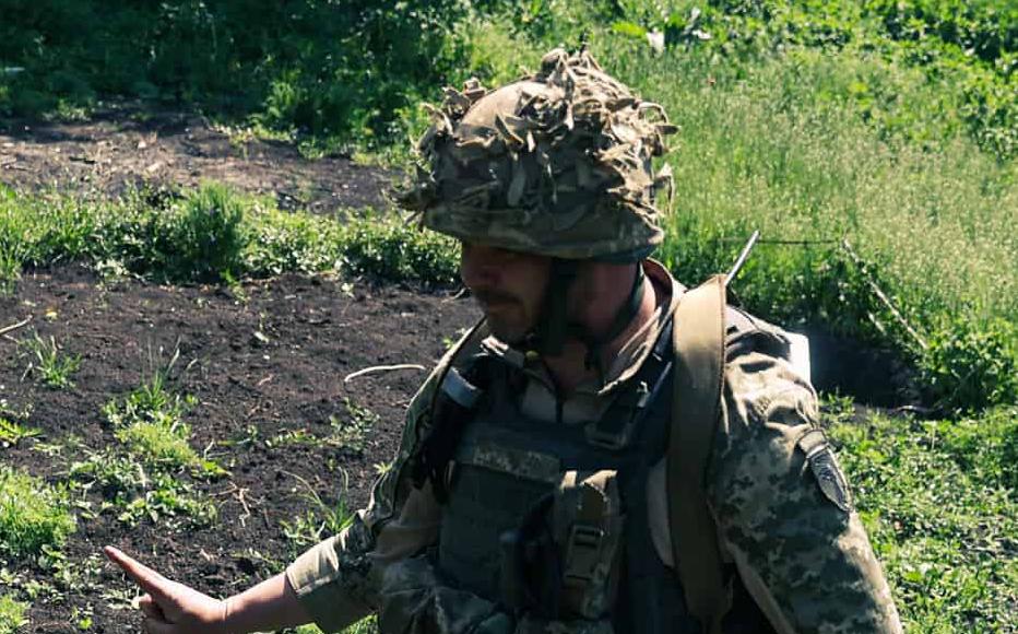 A Ukrainian soldier walks past a missile from the MLRS Uragan at the frontline positions near Izyum, the south of the Kharkiv region. May 23, 2022.