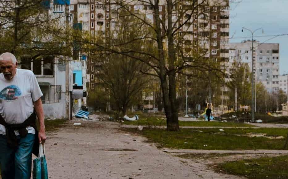 A resident ventures out of his apartment block in north Saltivka. (April 2022) A resident ventures out of his apartment block in north Saltivka. (April 2022)