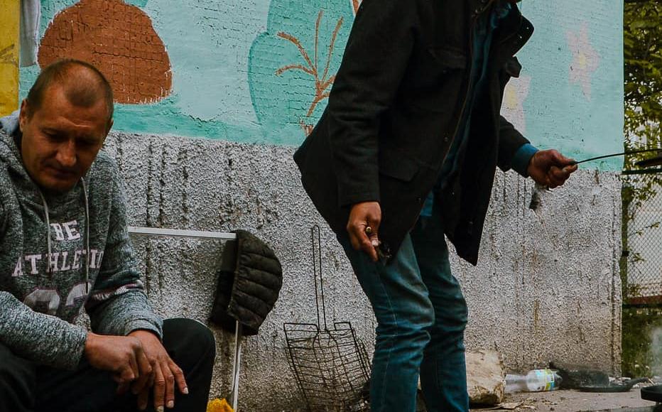 Serhiy, 59, cooks dinner with neighbours and friends on a open fire in the yard of his apartment block. (May 2022) Serhiy, 59, cooks dinner with neighbours and friends on a open fire in the yard of his apartment block. (May 2022)