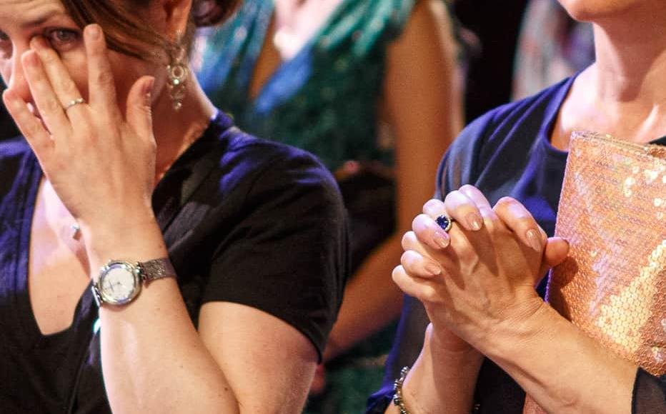 A woman wipes her tears after the performance Cry of a Nation. A woman wipes her tears after the performance Cry of a Nation.