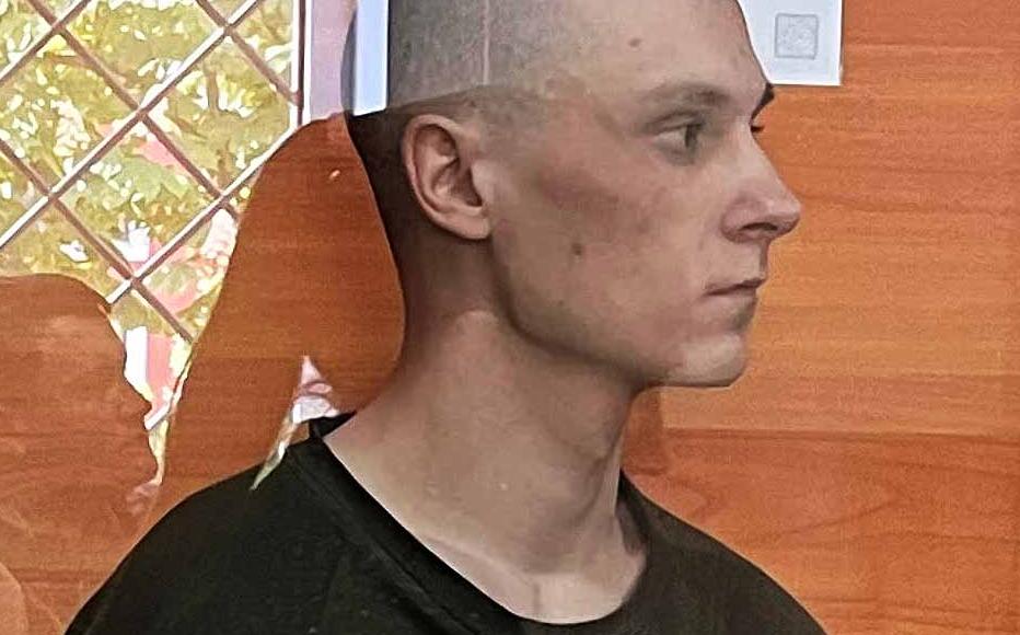 Russian prisoner of war Nikolay Kartashev stands in Irpinsky City Court of the Kyiv region on May 9. The 22-year-old paratrooper is accused of the killing of a supermarket security guard in Bucha in March 2022. © I. Domashchenko