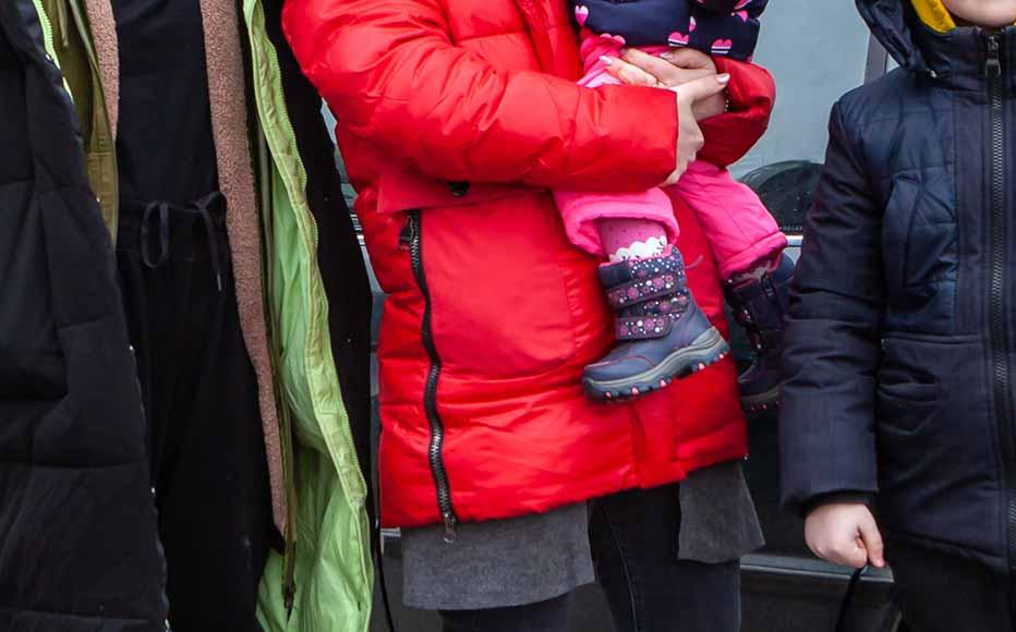 Olena Guzyova with her three children aged 12, eight and one year. She fled Shchastya, a town of 12,000 people near the contact line in Luhansk region shortly before the town came under heavy shelling. They are headed to Italy where Olena’s sister lives.