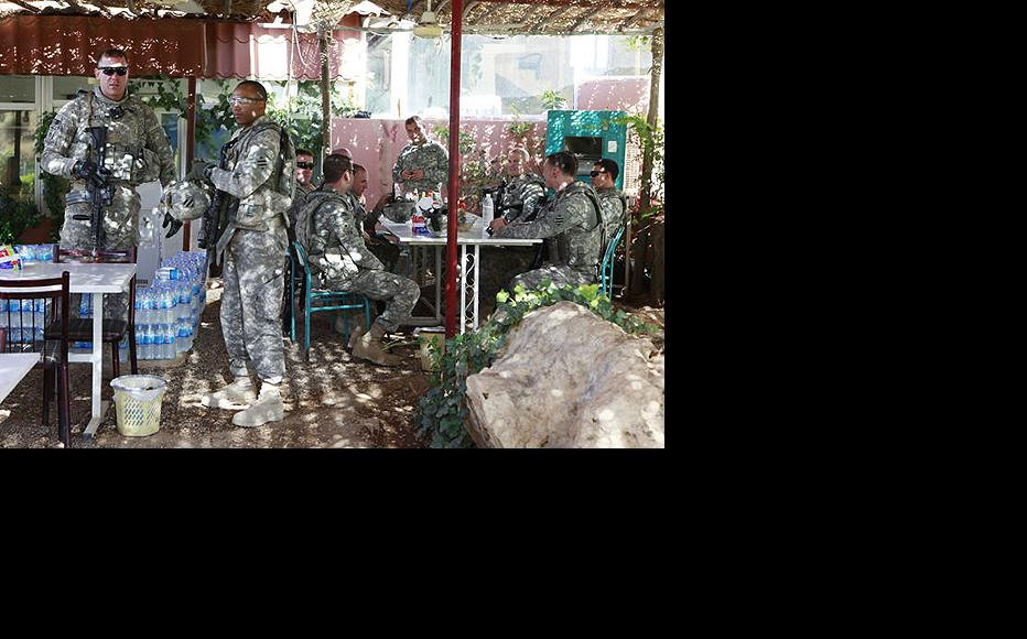 US patrol takes a break at a roadside cafe in Mosul. All combat troops have since left Iraq. (Photo: Tracey Shelton)