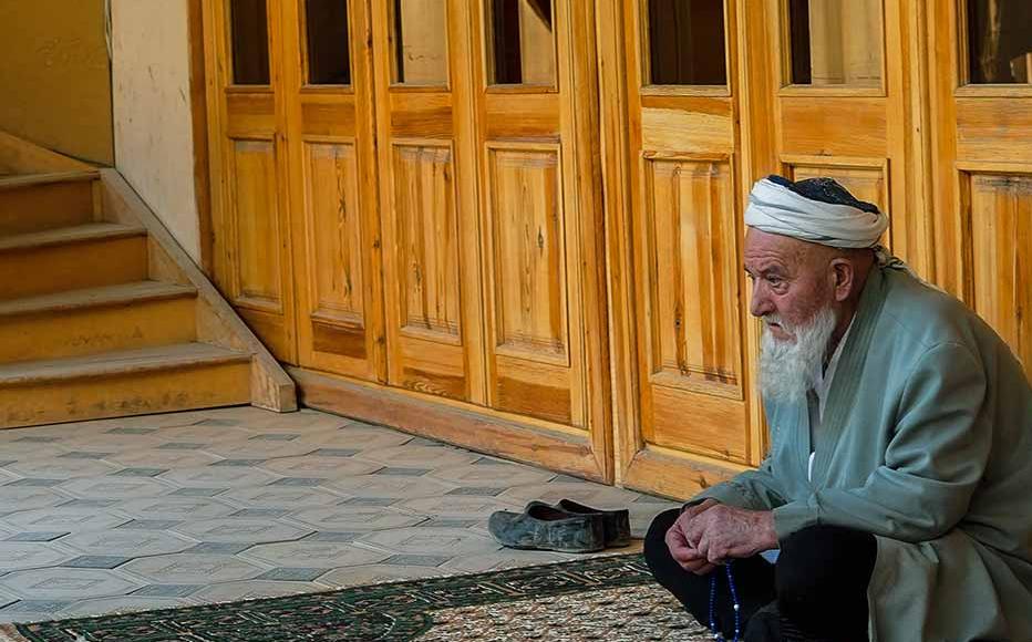 Men at the entrance of the mosque named after Muhammad Ibn Geloni. The mosque is not only a place for prayers, but a centre for the local community.