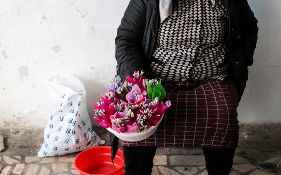 Salomat lives in a mountain village near Tashkent and sells flowers from her garden and the surrounding fields. Prices start at 1,000 som, or only one cent. She stands outside the subway station and sells her flowers before they wither; or before the police come and move her on.