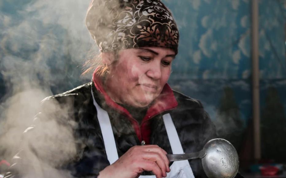 Firuza sells traditional Uzbek food at the market. She is saving her money to help pay for her granddaughters weddings.