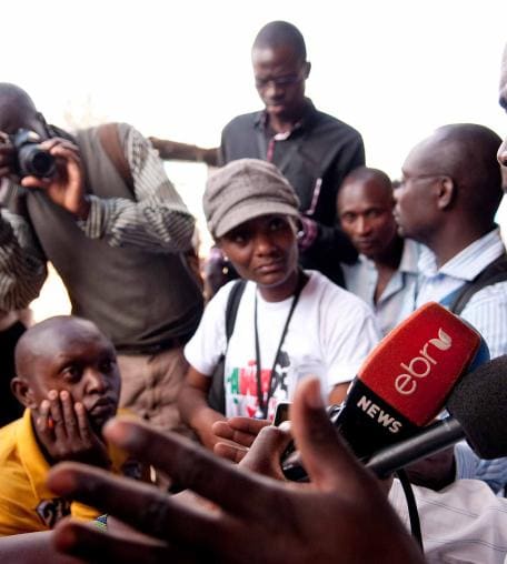 A bystander is interviewed by journalists in Nairobi, Kenya.