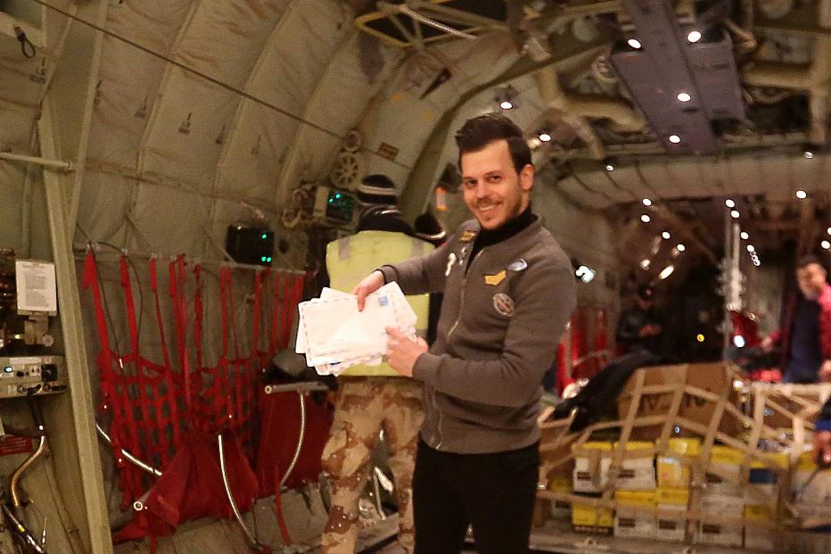 Sakar Maan, one of the activists that lead the initiative, inside the Iraqi airforce plane holding some of the letters about to be dropped over Mosul.