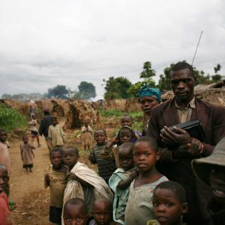 Refugees wait near their shelters in the village of Tongo, in the hills outside Goma, on November 4, 2008 in North Kivu province, Democratic Republic of Congo.