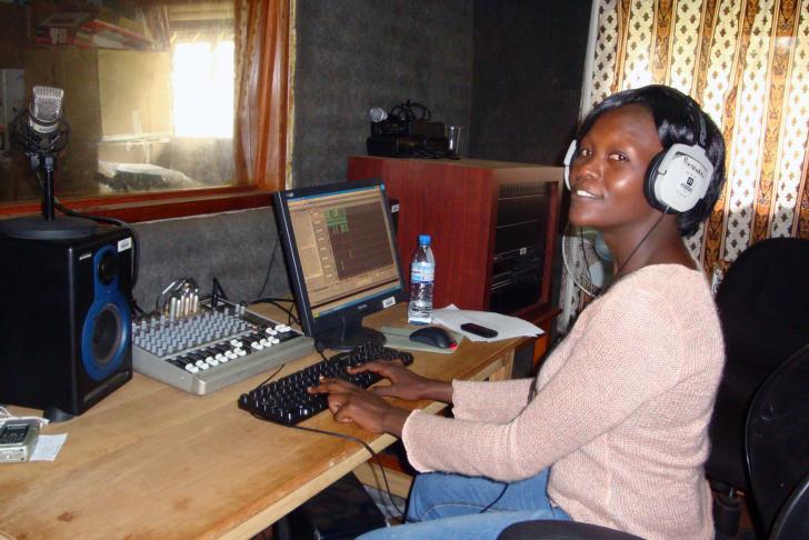 IWPR Uganda trainee Giliian Lamunu working on a radio story.