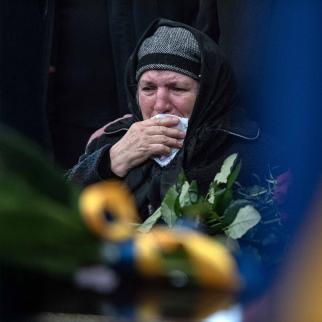 Mother of Ukrainian officer Ivan Skrypnyk cries during the funeral ceremony for her son on March 17, 2022 in Lviv, Ukraine. The soldier died in Sunday's airstrike on the nearby International Center for Peacekeeping and Security at the Yavoriv military complex.