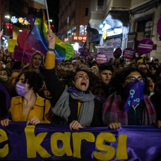 Women chant slogans and wave signs on Istiklal street during a demonstration marking International Day for the Elimination of Violence Against Women on November 25, 2021 in Istanbul, Turkey. Turkish President Recep Tayyip Erdogan withdrew Turkey from Istanbul Convention, which is an international human rights treaty of aiming to protect women against violence.