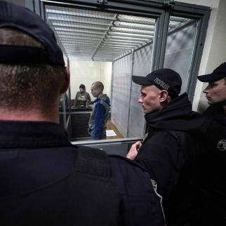 Captured Russian soldier, Sgt. Vadim Shishimarin, 21, attends a court hearing on May 18, 2022 in Kyiv, Ukraine. Sgt. Shishimarin pleaded guilty to shooting a civilian on a bicycle in the village of Chupakhivka, Sumy Region, days after Russia's invasion of Ukraine on Feb. 24.