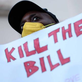 People gather with placards outside the Ghana High Commission in London on March 6, 2024, to protest against Ghana's anti-LGBTQ+ bill.