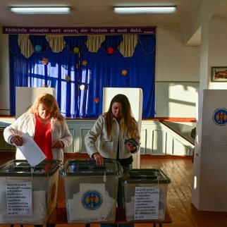 Two women vote during the presidential elections and a referendum on joining the European Union, at a polling station in the village Hirbovat, Moldova on October 20, 2024.