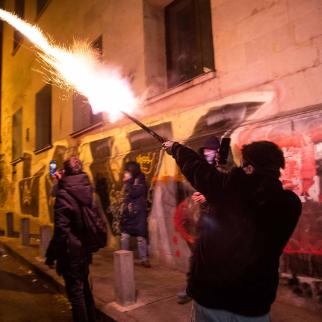 Demonstrators shoot fireworks at the police officers during a protest outside the parliament on November 29, 2024 in Tbilisi, Georgia.
