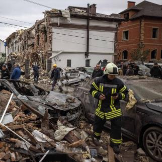 People try to clear the damage and locate their belongings at the scene of a Russian strike on September 28, 2025 in Kyiv, Ukraine. Ukrainian authorities said Russia launched another large overnight drone and missile attack on the capital. 