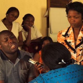 An actor plays a rapist in a role play situation during a training session on interviewing suspects in sexual violence cases. (Photo: Melanie Gouby)