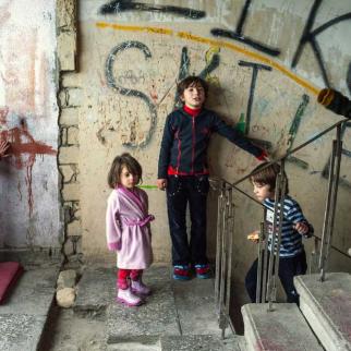 Children play on the stairs in the Bagebi dormitory; they have no other place to go.