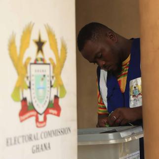 Ghana election official sealing the ballot box prior to the December 2024 presidential and parliamentary elections.