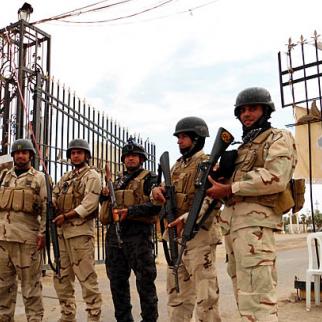 Iraqi security forces guard the camp, which houses many members of the Mojahedin-e Khalq, an insurgent group from Iran. (Photo: Ali Mohammed)