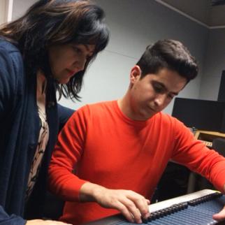 IWPR Tajik Radio editor Shahodat Soibnazarova (left) and IWPR contributor Davlater Baidullo discussing a story. (Photo: IWPR)