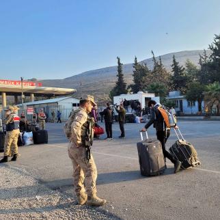 Syrian refugees at the Cilvegözü border crossing in Turkey, waiting to return to Syria.
