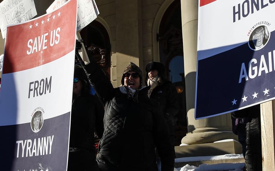Protestors rally at the Michigan State Capitol. Protestors rally at the Michigan State Capitol.