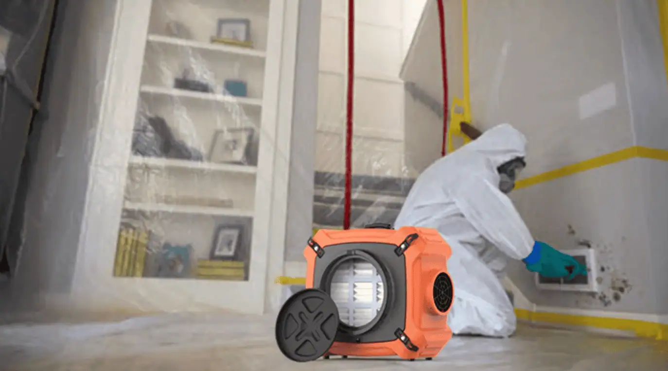 HEPA air scrubber machine operating in a contained room