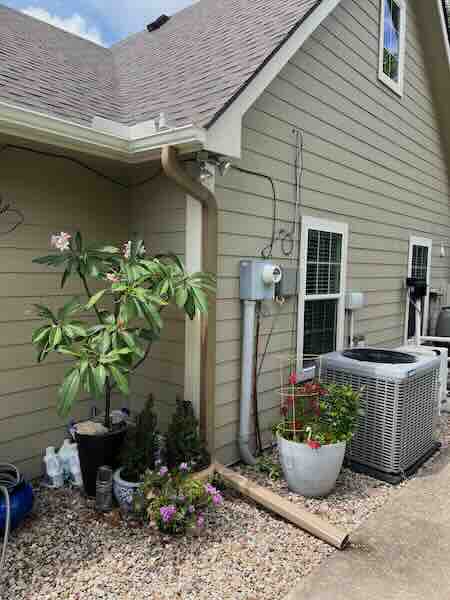 Exterior gutter and drainage installation on a North Texas home