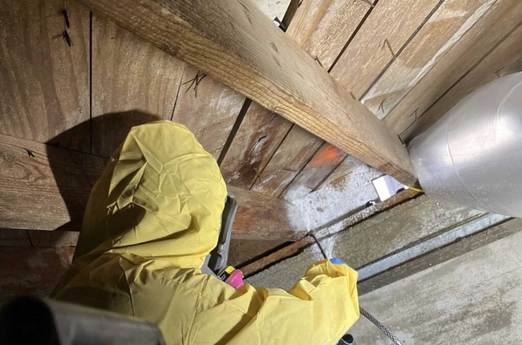 Rainy Day technician performing crawl space moisture control in North Texas