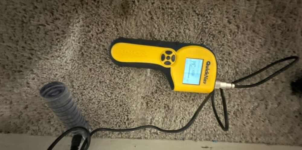 Technician documenting moisture damage in Anna, TX