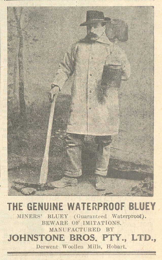 A newspaper snippet showing a picture of a man wearing a waterproof coat. the text reads: The genuine waterproof bluey. Miners' bluey (guaranteed waterproof). Beware of imitations. Manufactured by Johnstone Brod. PTY., LTD., Derwent Wollen Mills, Hobart.