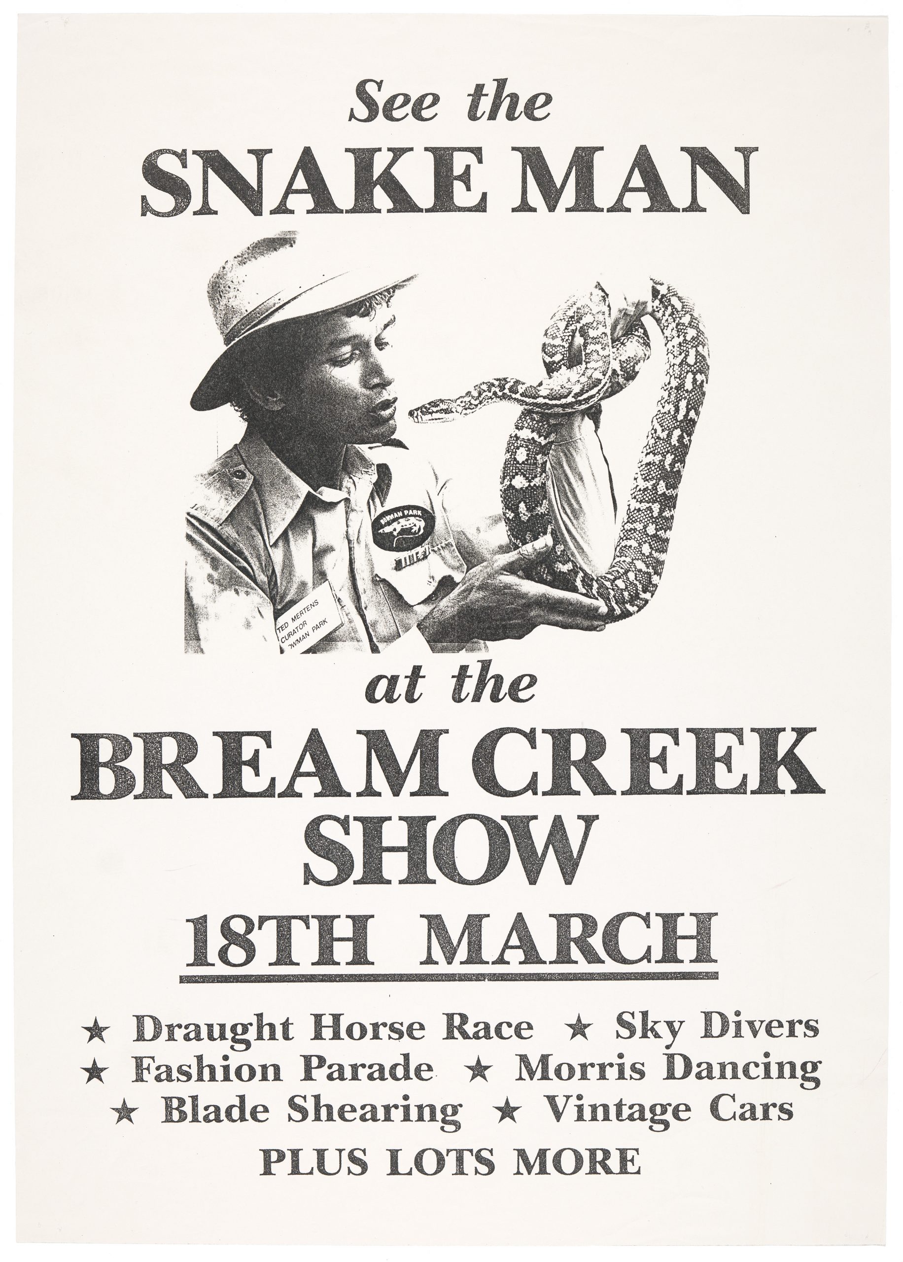 A poster. it reads "See the snake man. at the bream creek show. 18th March. Draught horse race. Sky divers. Fashion Parade. Morris Dancing. Blade shearing. Vintage cars." There is a picture of a man holding a snake to his face.