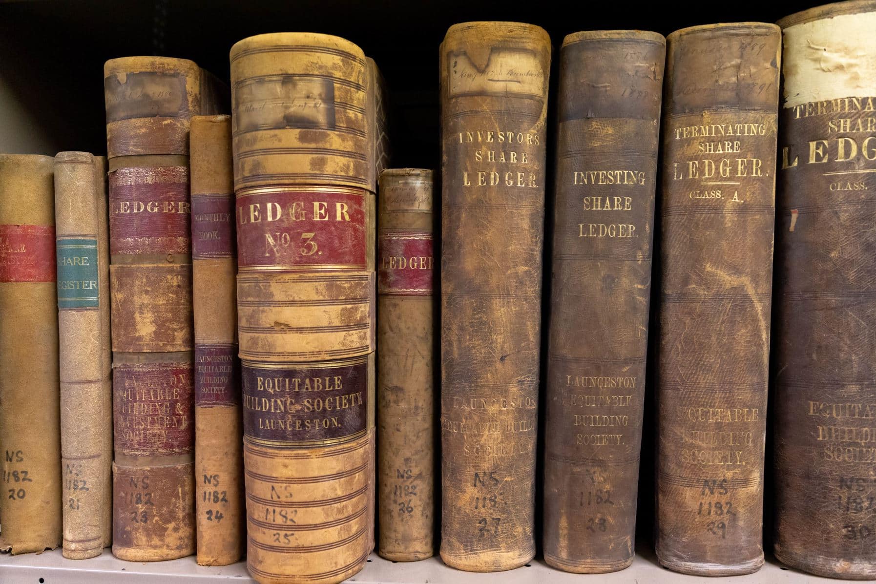 Archival materials on the shelf at the State Library of Tasmania and Tasmanian Archives Reading Room.