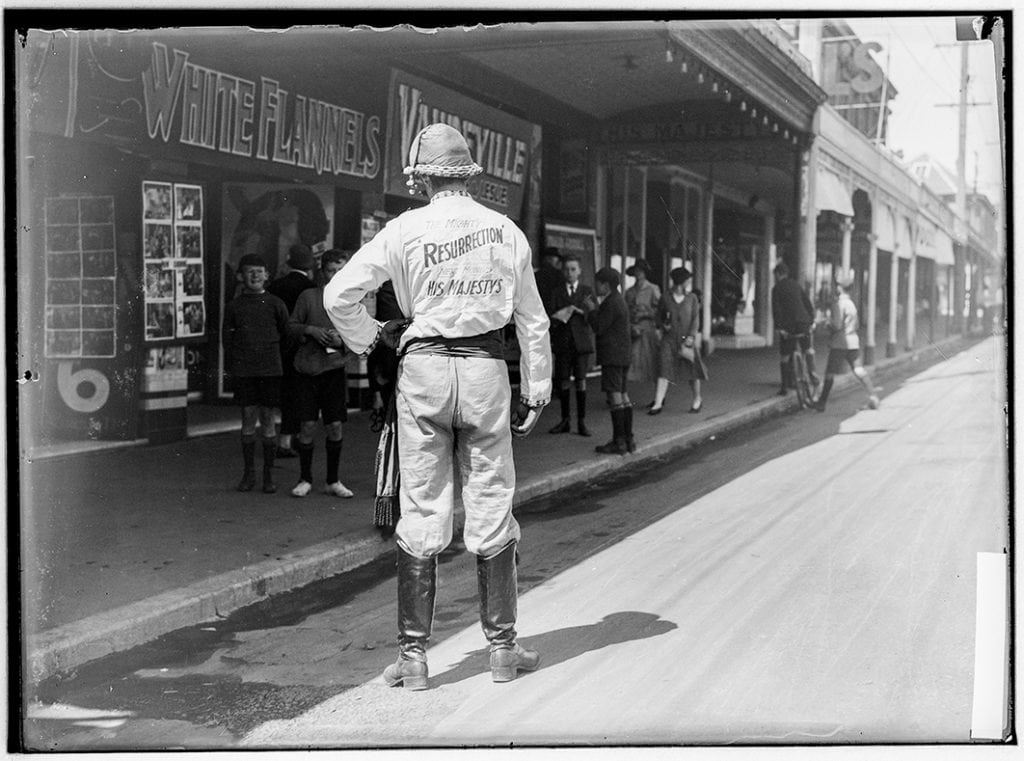 Photograph - Man in street dressed to advertise movie 'Resurrection' Nov 1931, Hobart [glass plate negative] [His Majestys Theatre, Liverpool Street]