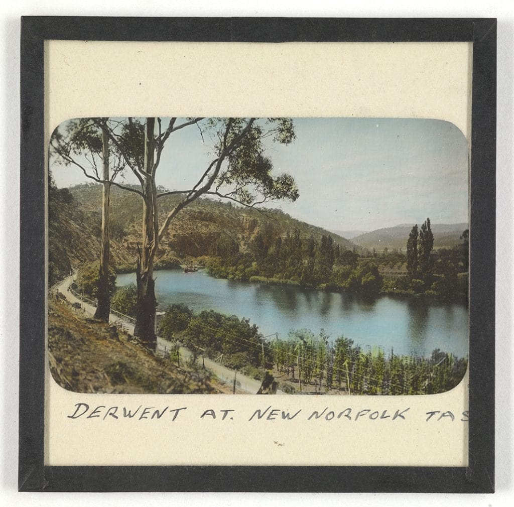 Photograph - 'Derwent at New Norfolk, TAS' (steamboat on river in background) (hand coloured) [Lantern Slide] [Box 5 (small box 2)]