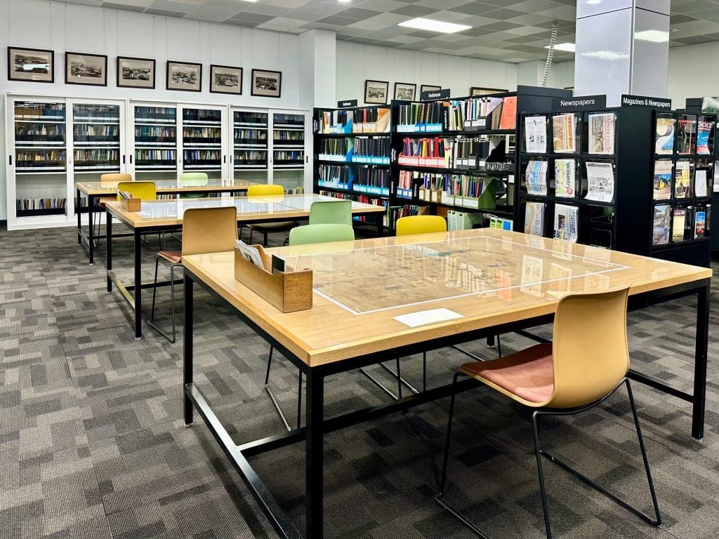 Study space with tables, chairs and shelves of books and other reference material