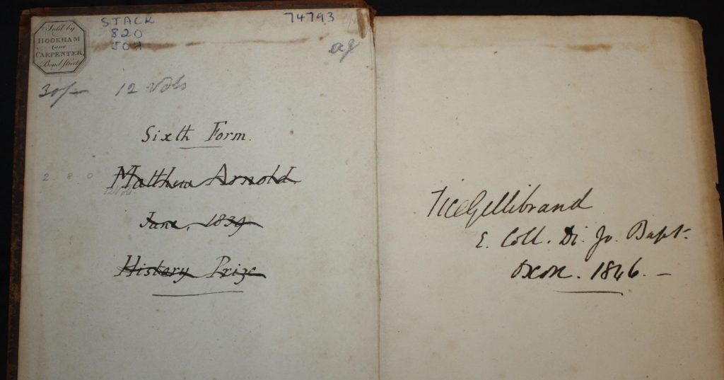 2 pages of a book with cursive writing.